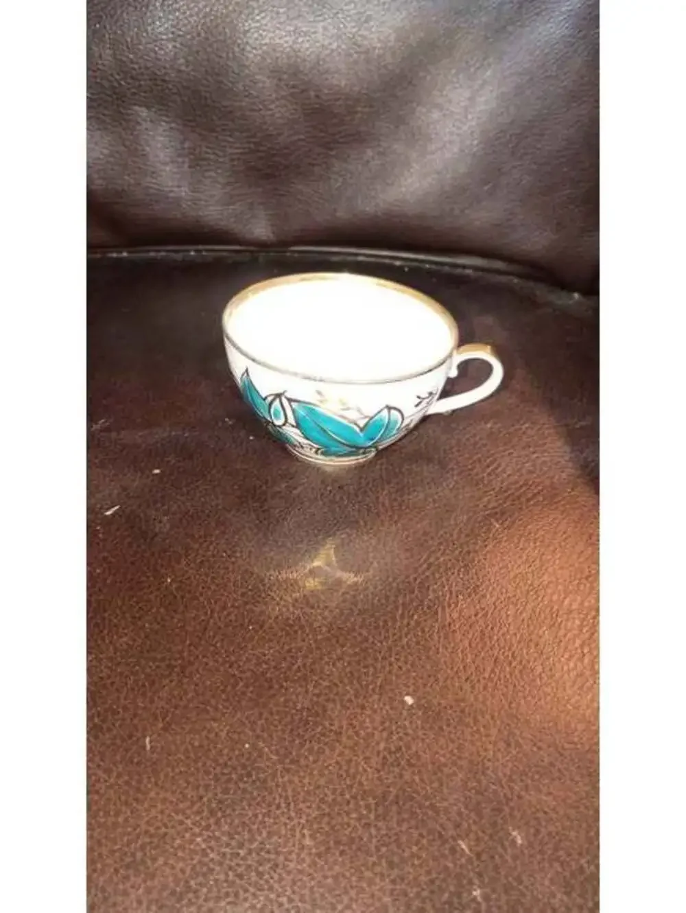 Vintage Ceramic Teacup with Blue Floral Design and Gold Trim